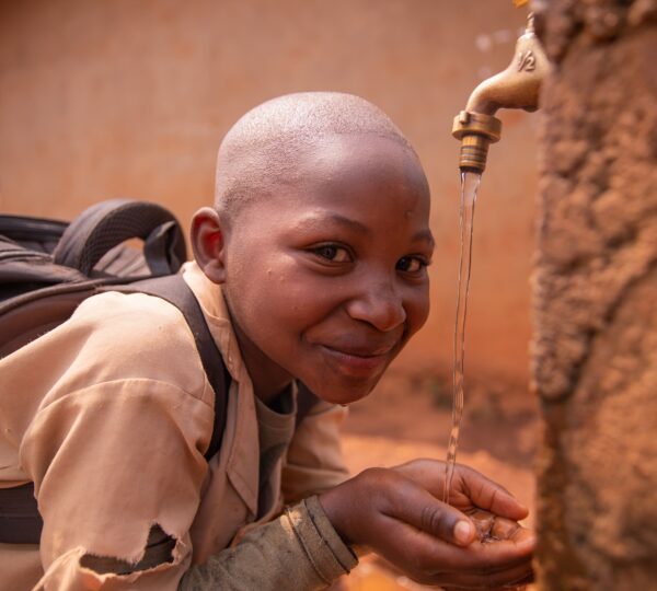 black-schoolchild-collects-water-with-his-hands-fr-2025-03-09-15-08-30-utc